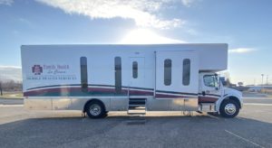 The Mobile Health unit parked in a parking lot.