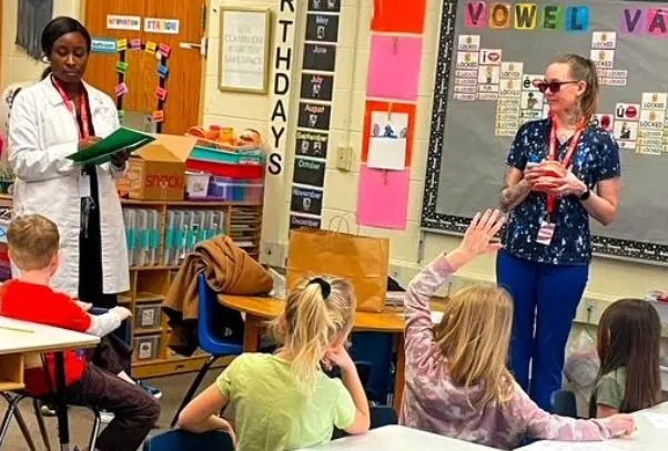 Dentist and Hygienist in a classroom